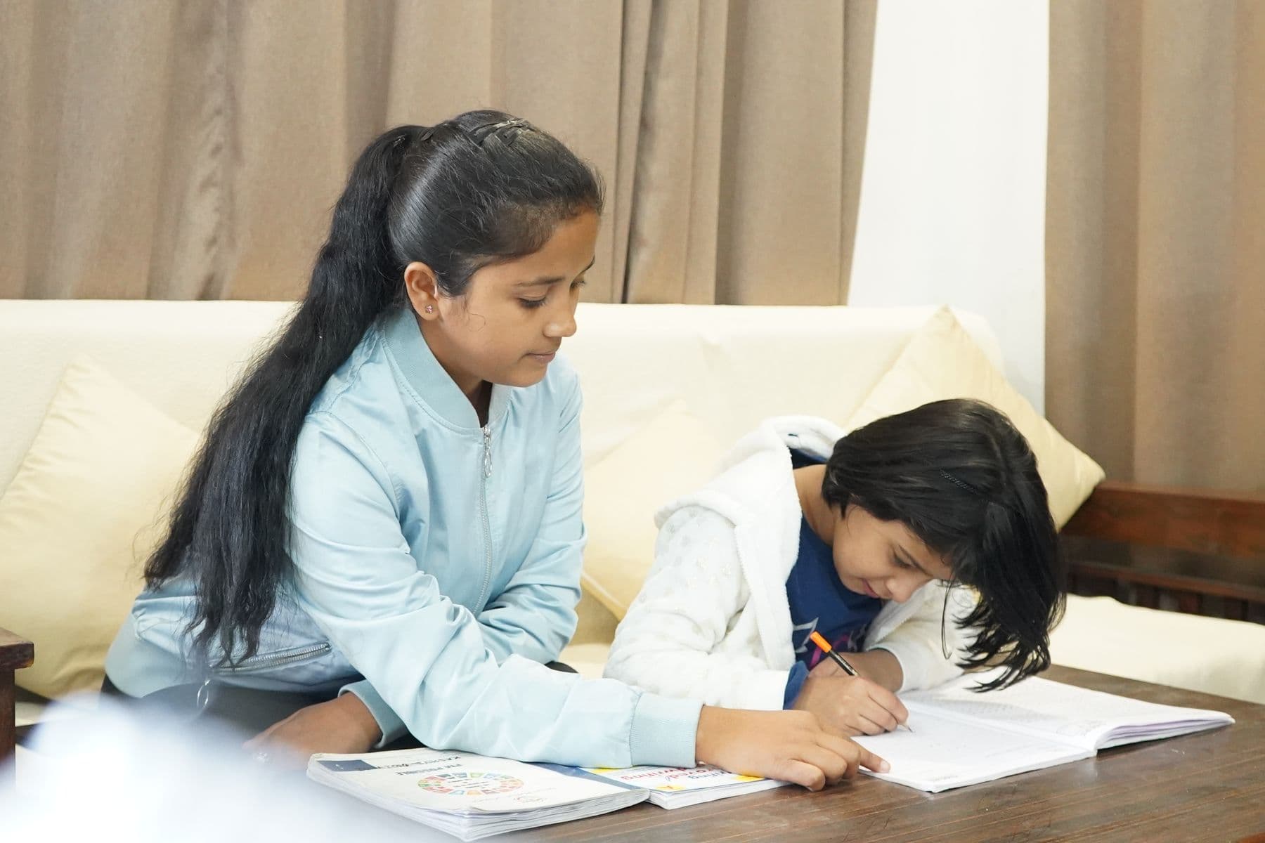 A verified home tutor teaching a student at home
